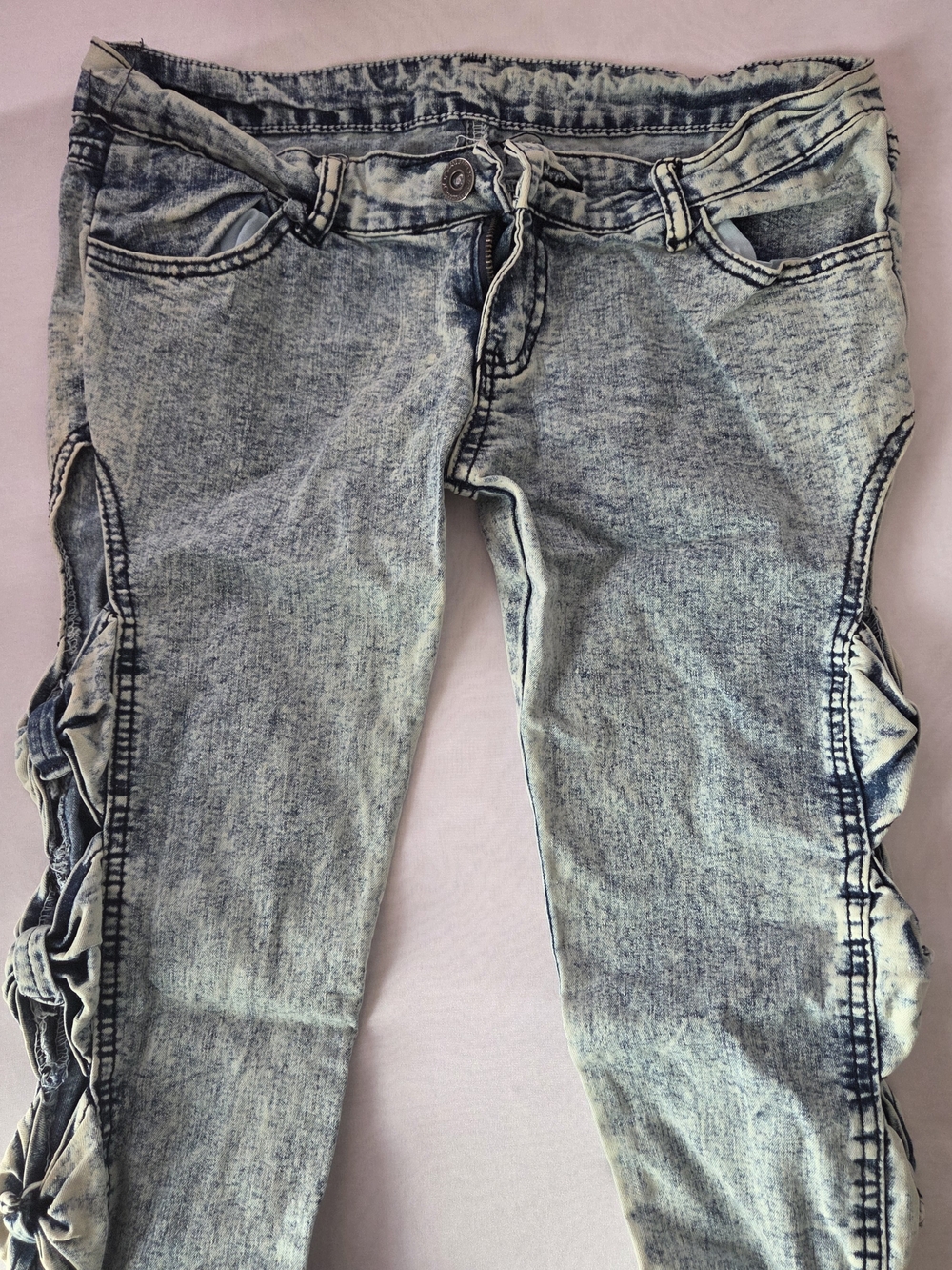 Women’s Light Acid Wash Low Rise Denim Jeans with Cutout Bow Details